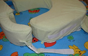 Non-adjustable buckle strap and Velcro on one side of My Brest Friend Twins Pillow