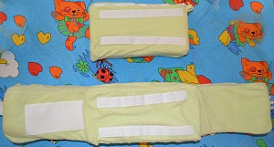 Velcro strips on back support pillow and back panel