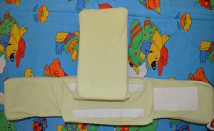 Back support pillow raised and attached to the back panel